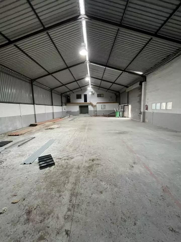 Inside a large warehouse after building work