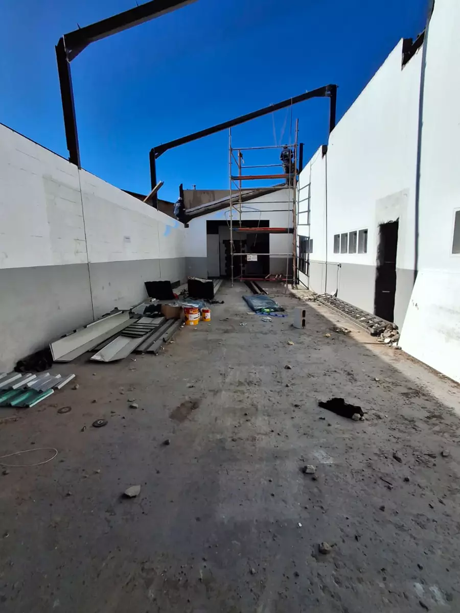 Steel structure going up between two buildings